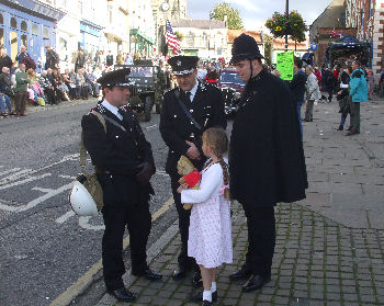 Policeman and officers with little girl at the Pickering 1940s weekend